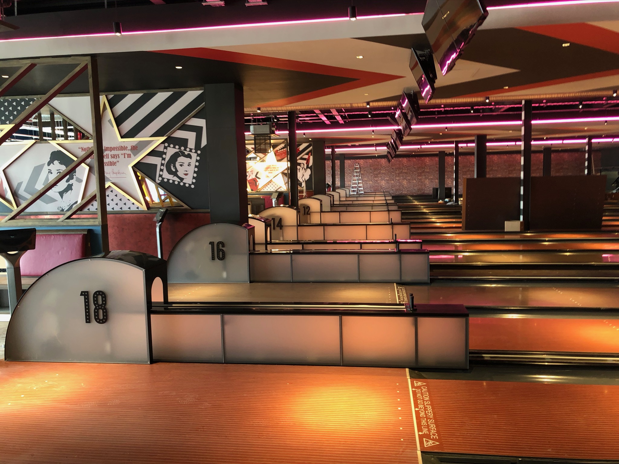 Hollywood Bowl York bowling lanes with bespoke seating, scoring consoles and decorative panelling